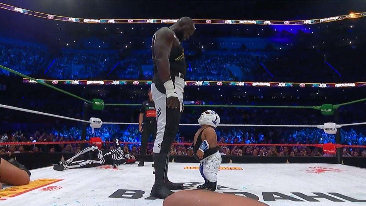 Historic Height Differential Witnessed as 3-foot-3 Microman Confronts 7-foot-3 Omos at AAA Triplemania XXXIII